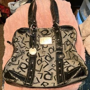 Lines Rosetti large bag. Has charm you can remove or move it to a different spot